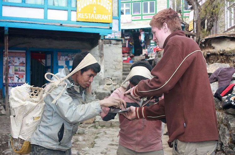 Joseph De Mayeu distributing chocolate in Namshe