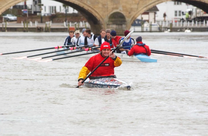 Tim Fitzhigham paddling his paper boat down the River Thames